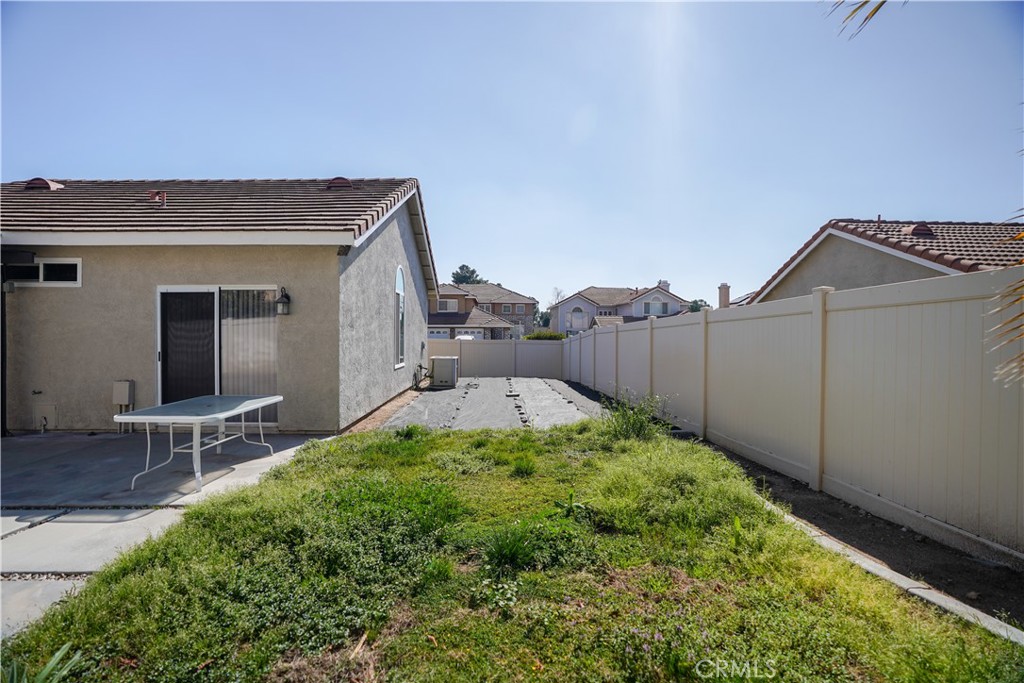 7562 Webster Street Highland, CA 92346 - Photo 28 of 30 a backyard of a house with table and chairs