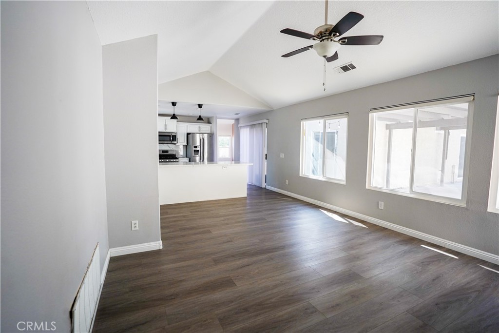 7562 Webster Street Highland, CA 92346 - Photo 7 of 30 wooden floor in an empty room with a window