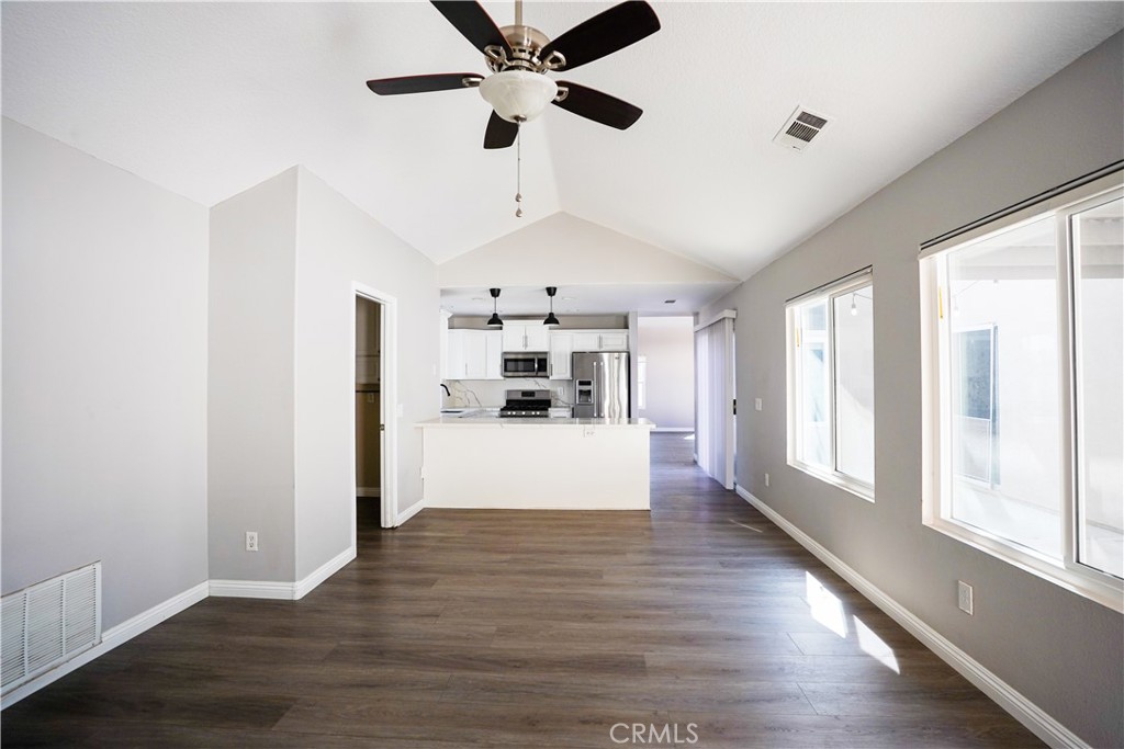7562 Webster Street Highland, CA 92346 - Photo 8 of 30 a view of a big room with wooden floor and windows