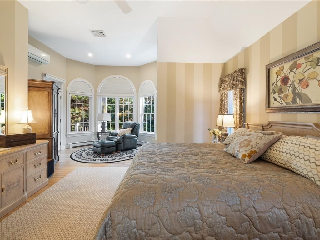 15 Cushing Hill Road Hanover, MA 02339 - Photo 20 of 42 a large bedroom with a bed a large window and furniture