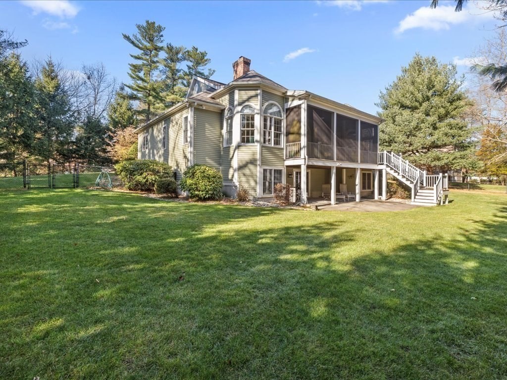 15 Cushing Hill Road Hanover, MA 02339 - Photo 3 of 42 a front view of a building with a garden