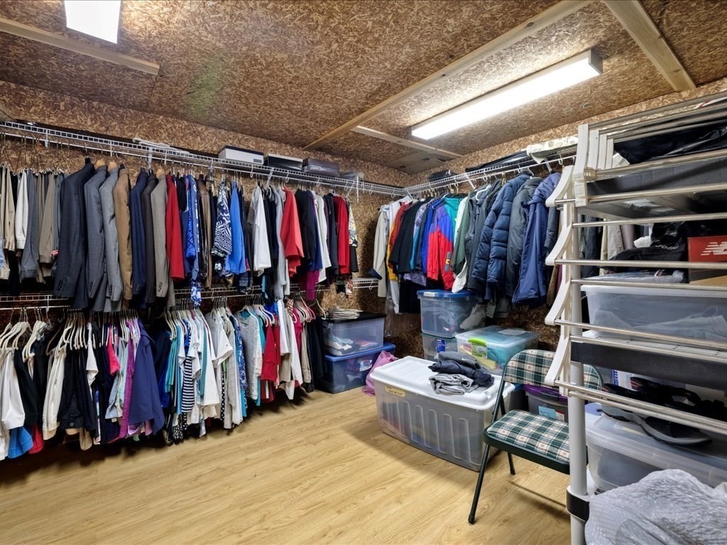 15 Cushing Hill Road Hanover, MA 02339 - Photo 36 of 42 a view of walk in closet with clothes