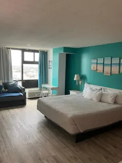 a living room with furniture and large windows
