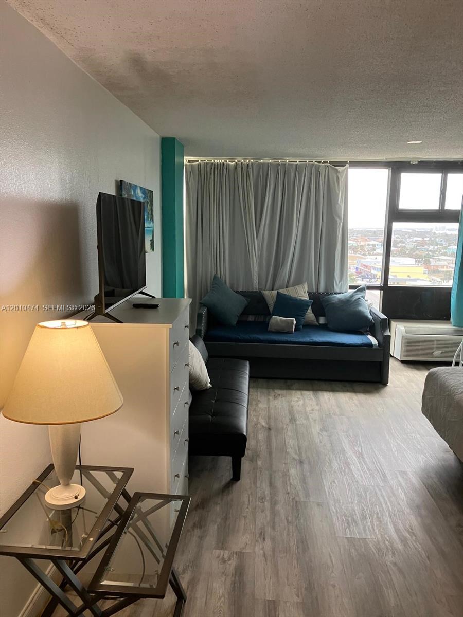 1909 South Atlantic Avenue, Unit 803804 Daytona Beach, FL 32118 - Photo 14 of 43 a living room with furniture and large windows