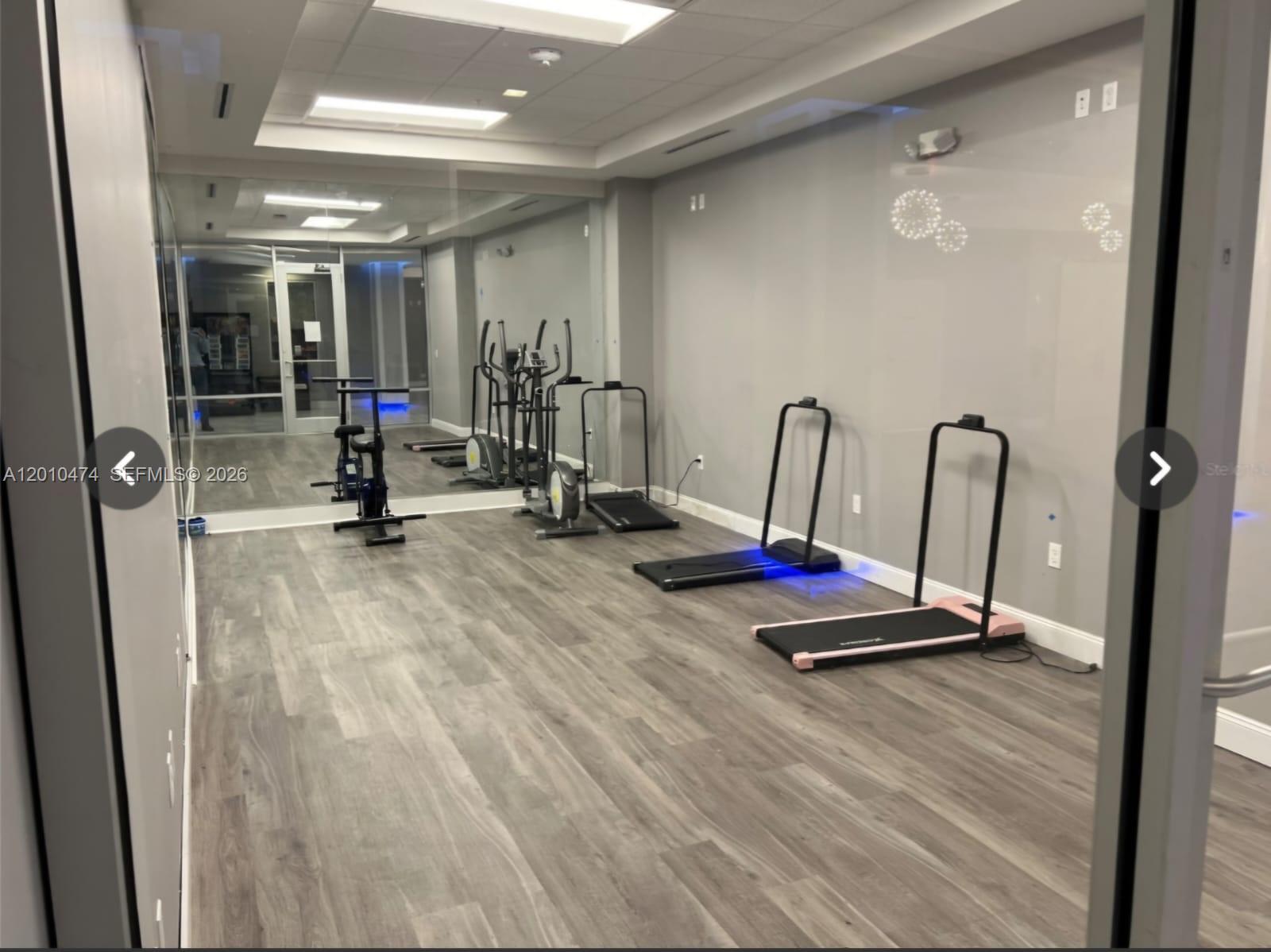 1909 South Atlantic Avenue, Unit 803804 Daytona Beach, FL 32118 - Photo 19 of 43 a view of a room with gym equipment