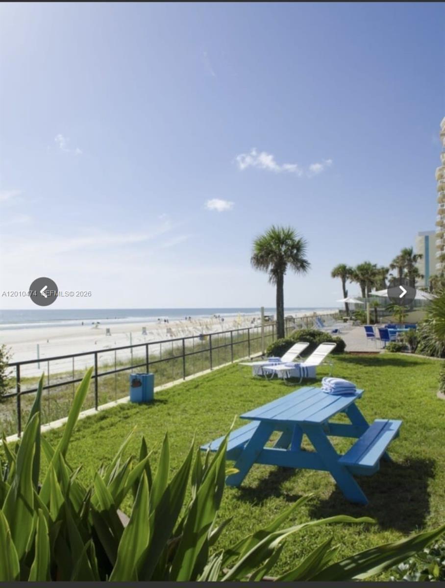1909 South Atlantic Avenue, Unit 803804 Daytona Beach, FL 32118 - Photo 37 of 43 a view of swimming pool with a garden and seating area
