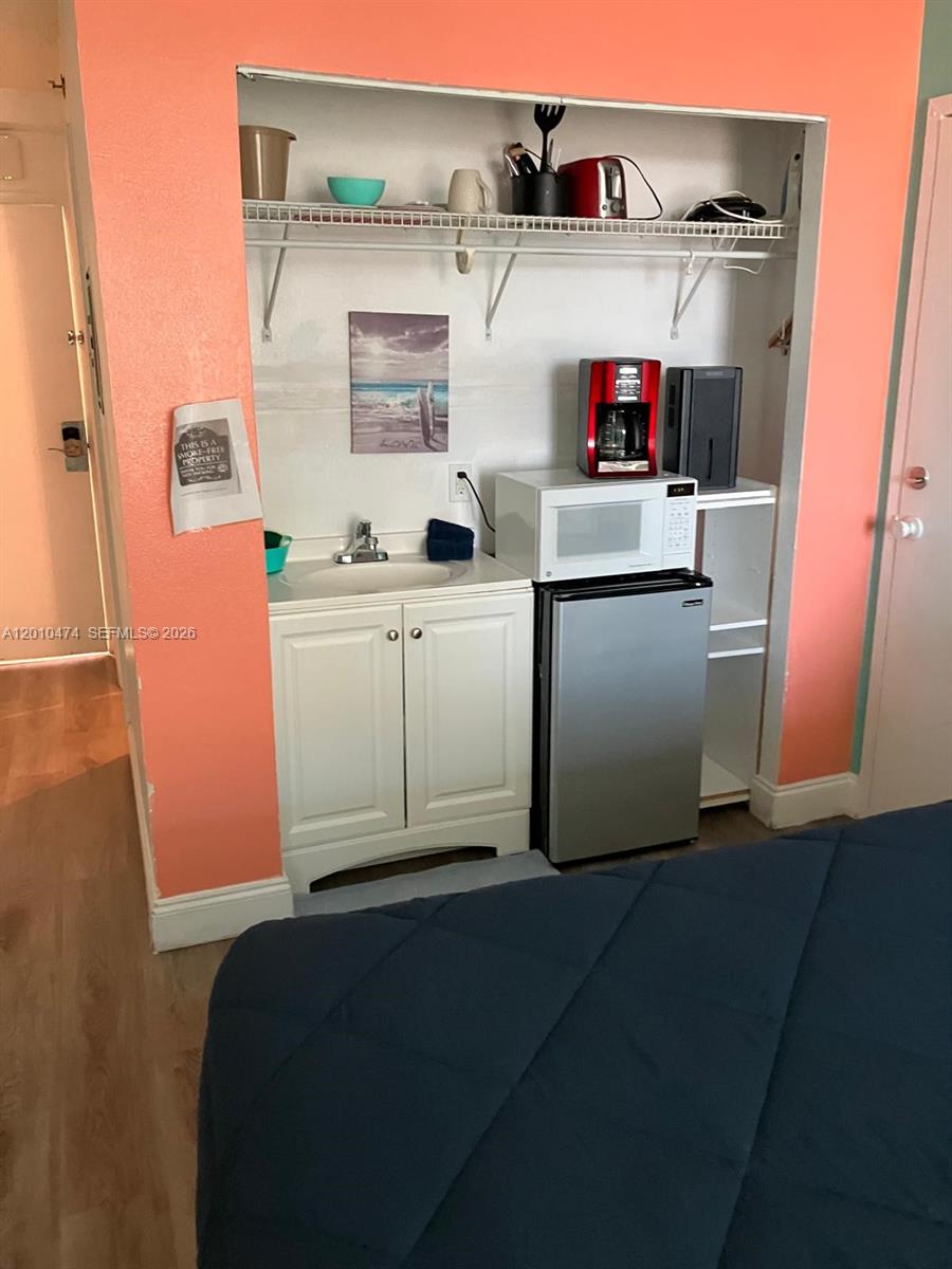1909 South Atlantic Avenue, Unit 803804 Daytona Beach, FL 32118 - Photo 5 of 43 a utility room with dryer and washer
