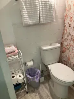a bathroom with a toilet and a sink