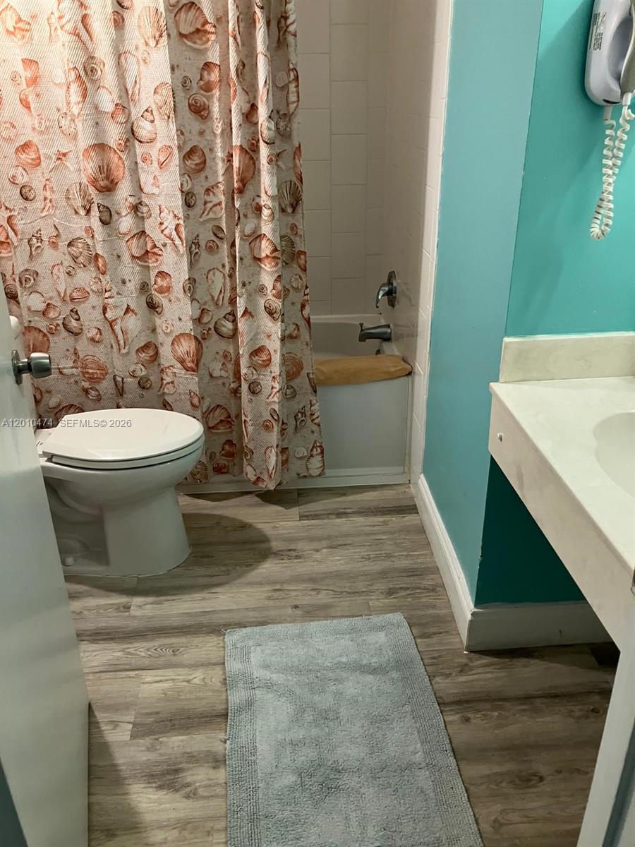 1909 South Atlantic Avenue, Unit 803804 Daytona Beach, FL 32118 - Photo 7 of 43 a bathroom with a toilet and a sink