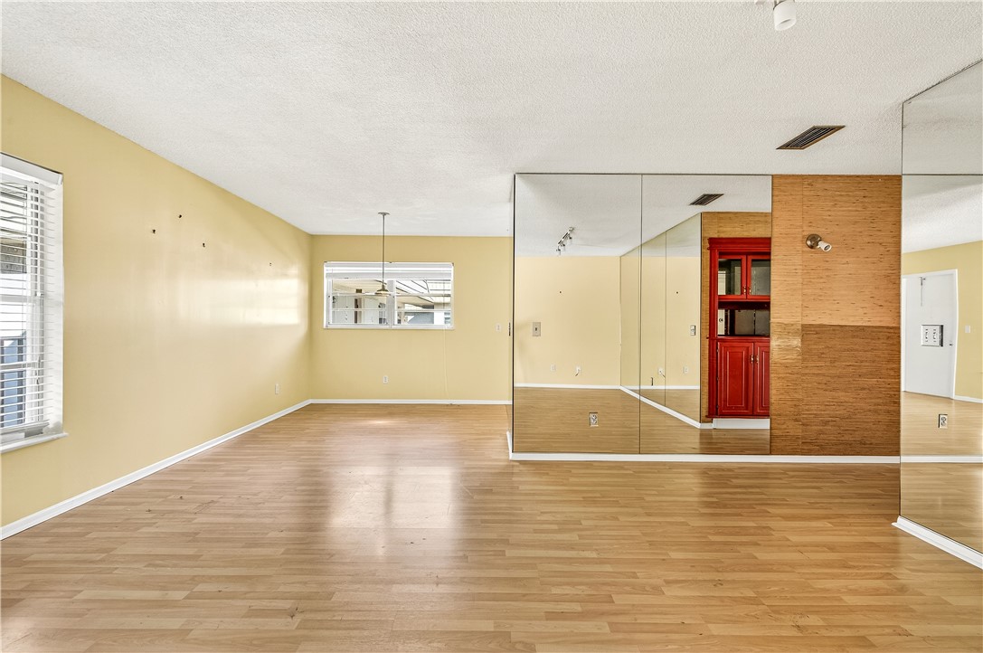 45 Vista Gdns Trail, Unit 202 Vero Beach, FL 32962 - Photo 13 of 32 a view of empty room with wooden floor