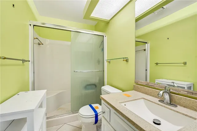 a bathroom with a sink toilet tub and shower