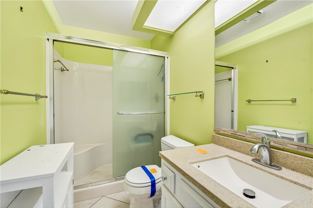 45 Vista Gdns Trail, Unit 202 Vero Beach, FL 32962 - Photo 18 of 32 a bathroom with a sink toilet tub and shower