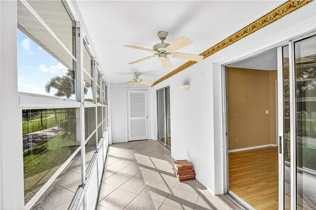 a porch with a glass door shower and yard