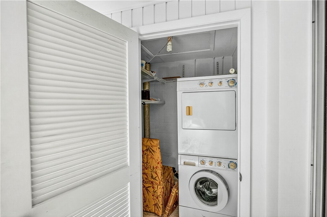 45 Vista Gdns Trail, Unit 202 Vero Beach, FL 32962 - Photo 22 of 32 a utility room with dryer and washer