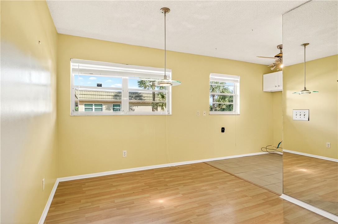 45 Vista Gdns Trail, Unit 202 Vero Beach, FL 32962 - Photo 6 of 32 a view of a room with wooden floor