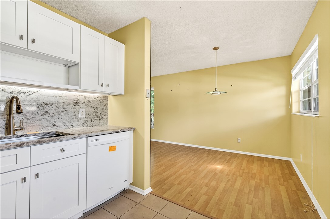 45 Vista Gdns Trail, Unit 202 Vero Beach, FL 32962 - Photo 9 of 32 a bathroom with a sink and a mirror