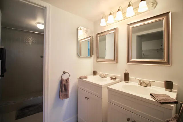 a bathroom with a bathtub and shower