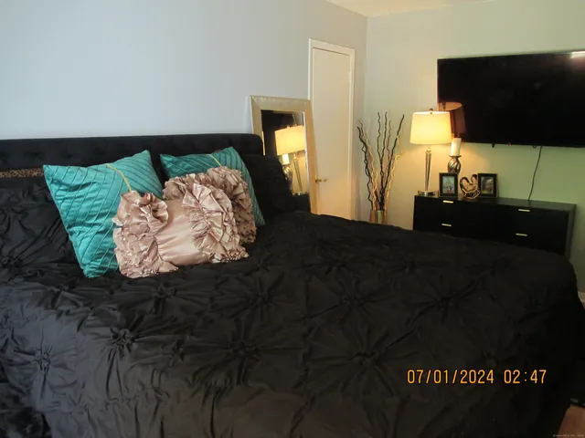 a living room with a bed