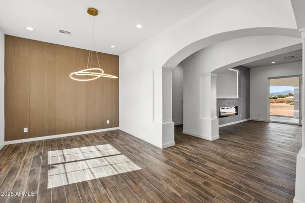 a bathroom with a granite countertop double vanity sink and mirror