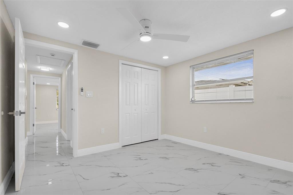 5626 Moog Road Holiday, FL 34690 - Photo 26 of 38 an empty room with windows and closet