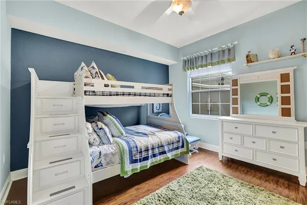 a bed room with a bed and a window