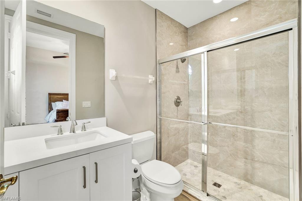 9234 Tesoro Lane, Unit 101 Naples, FL 34114 - Photo 22 of 25 a bathroom with a sink toilet and shower