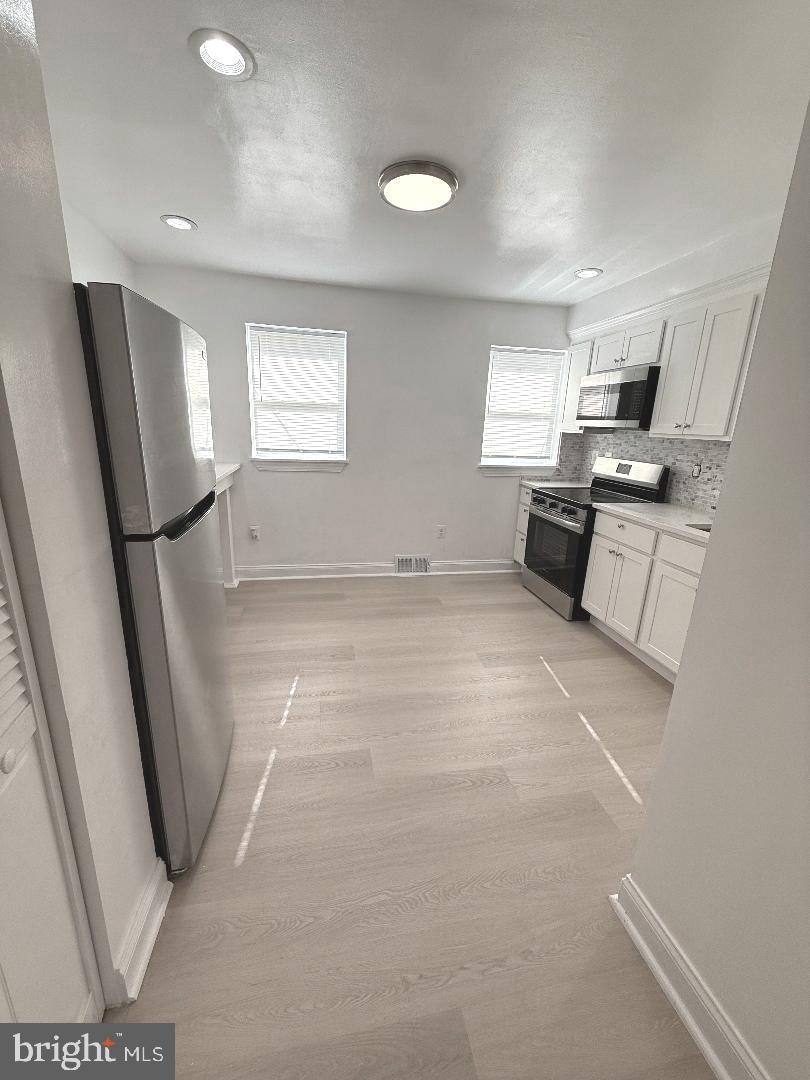 815 East Cold Spring Lane Baltimore, MD 21212 - Photo 15 of 43 a view of a kitchen with furniture and a window