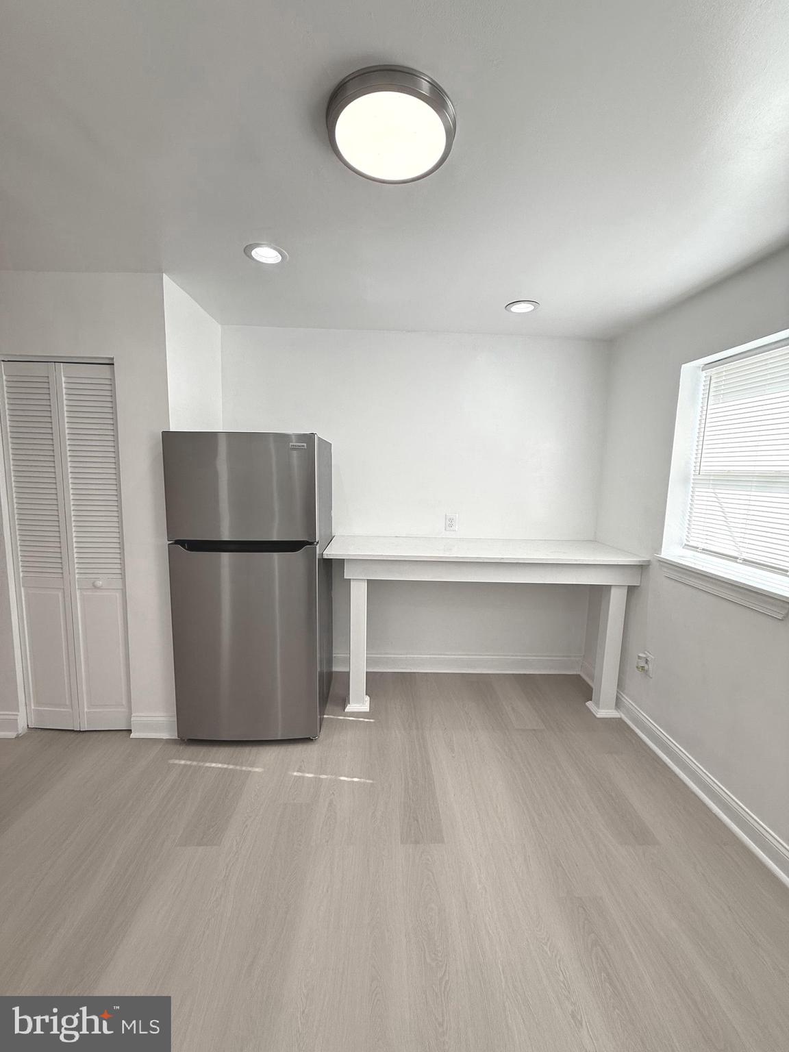 815 East Cold Spring Lane Baltimore, MD 21212 - Photo 17 of 43 a view of a kitchen with a refrigerator and a dishwasher