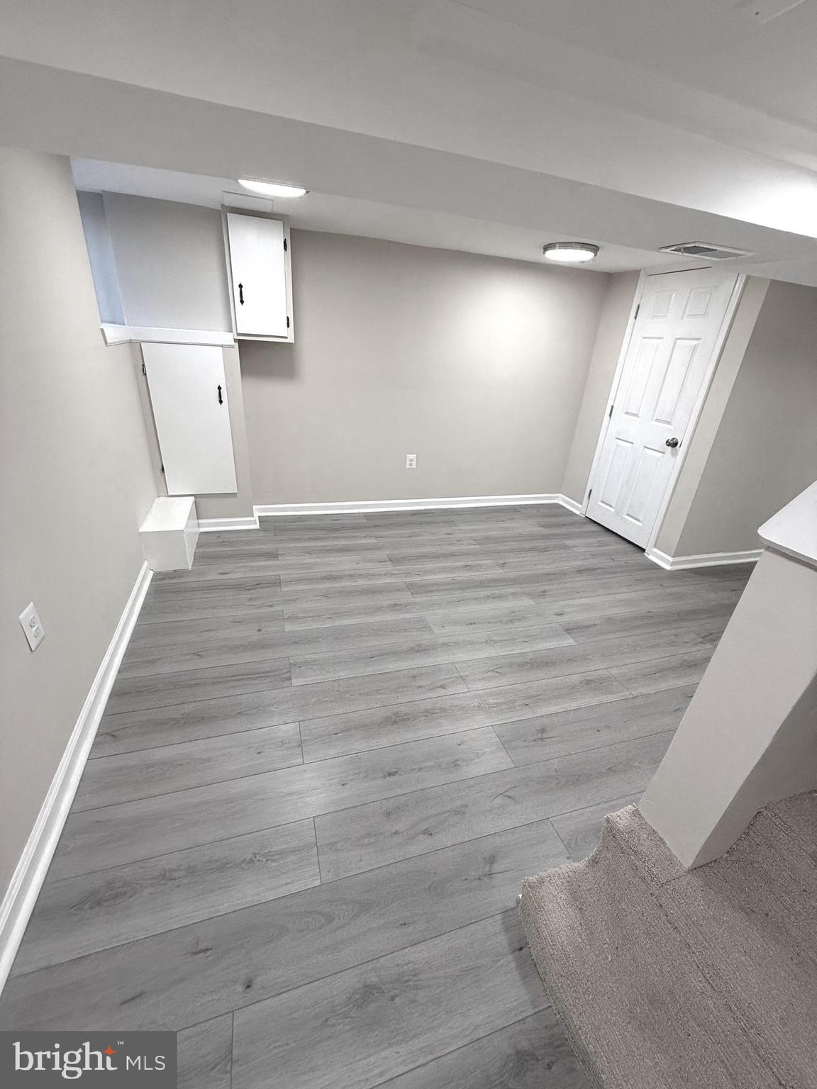 815 East Cold Spring Lane Baltimore, MD 21212 - Photo 25 of 43 a view of empty room with wooden floor