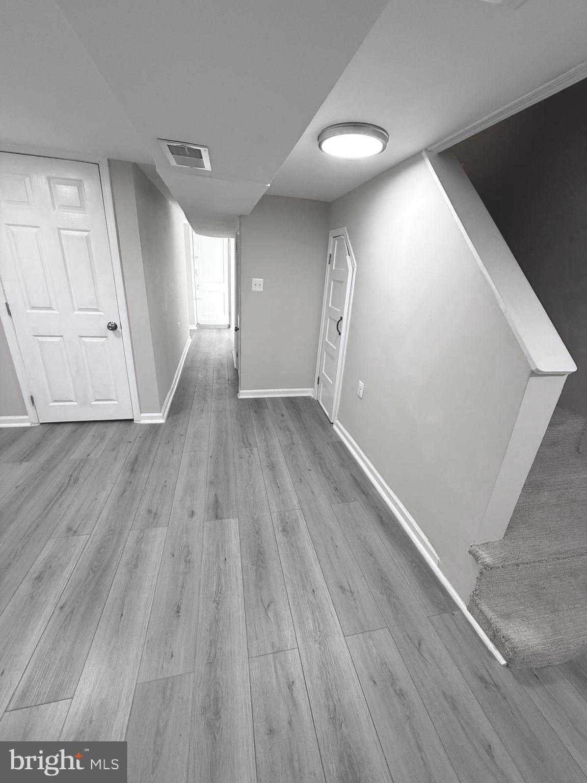 815 East Cold Spring Lane Baltimore, MD 21212 - Photo 26 of 43 a view of empty room with wooden floor