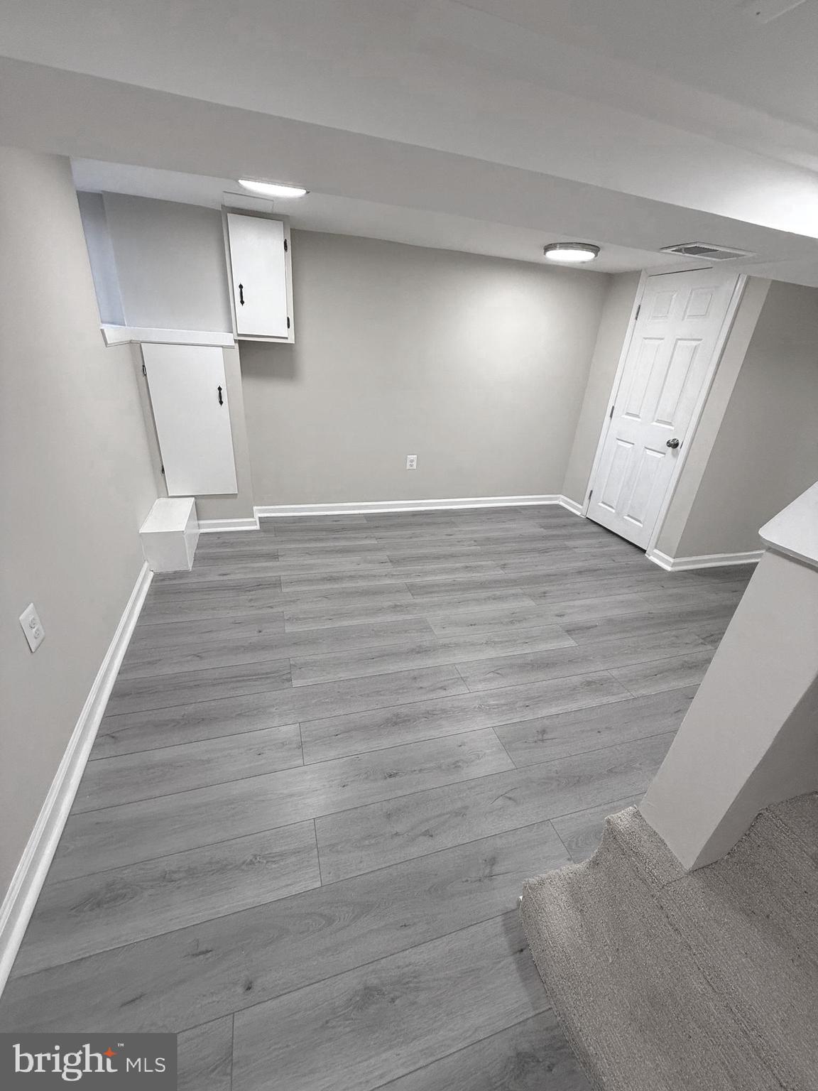 815 East Cold Spring Lane Baltimore, MD 21212 - Photo 28 of 43 a view of empty room with wooden floor