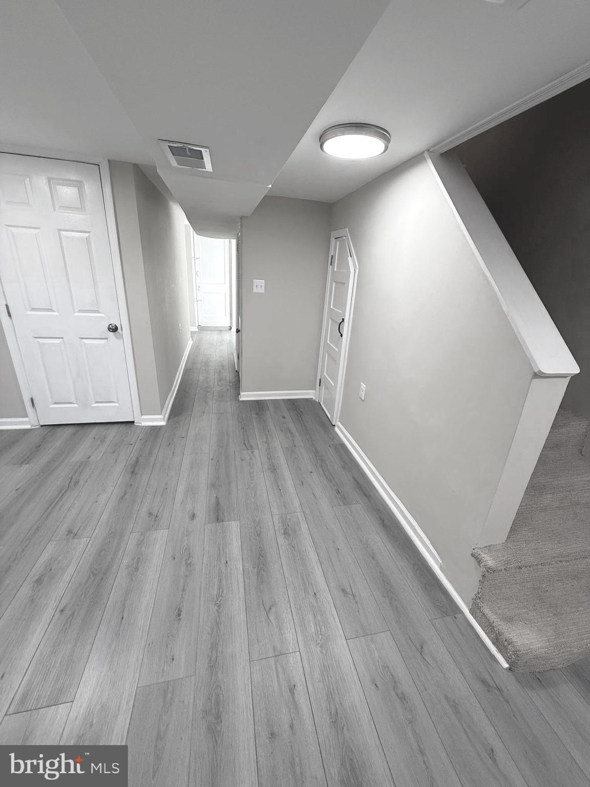 815 East Cold Spring Lane Baltimore, MD 21212 - Photo 30 of 43 a view of empty room with wooden floor