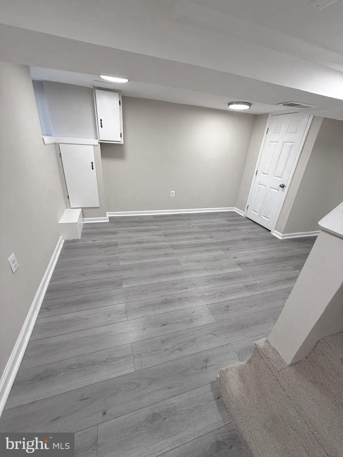 815 East Cold Spring Lane Baltimore, MD 21212 - Photo 32 of 43 a view of empty room with wooden floor