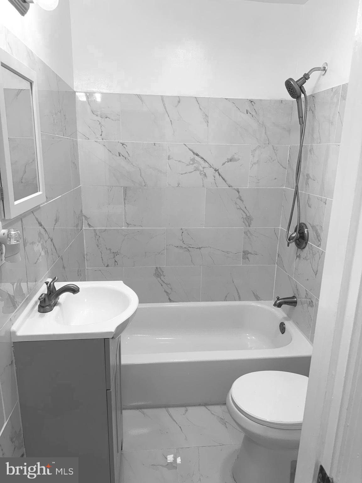 815 East Cold Spring Lane Baltimore, MD 21212 - Photo 34 of 43 a bathroom with a sink a toilet and shower