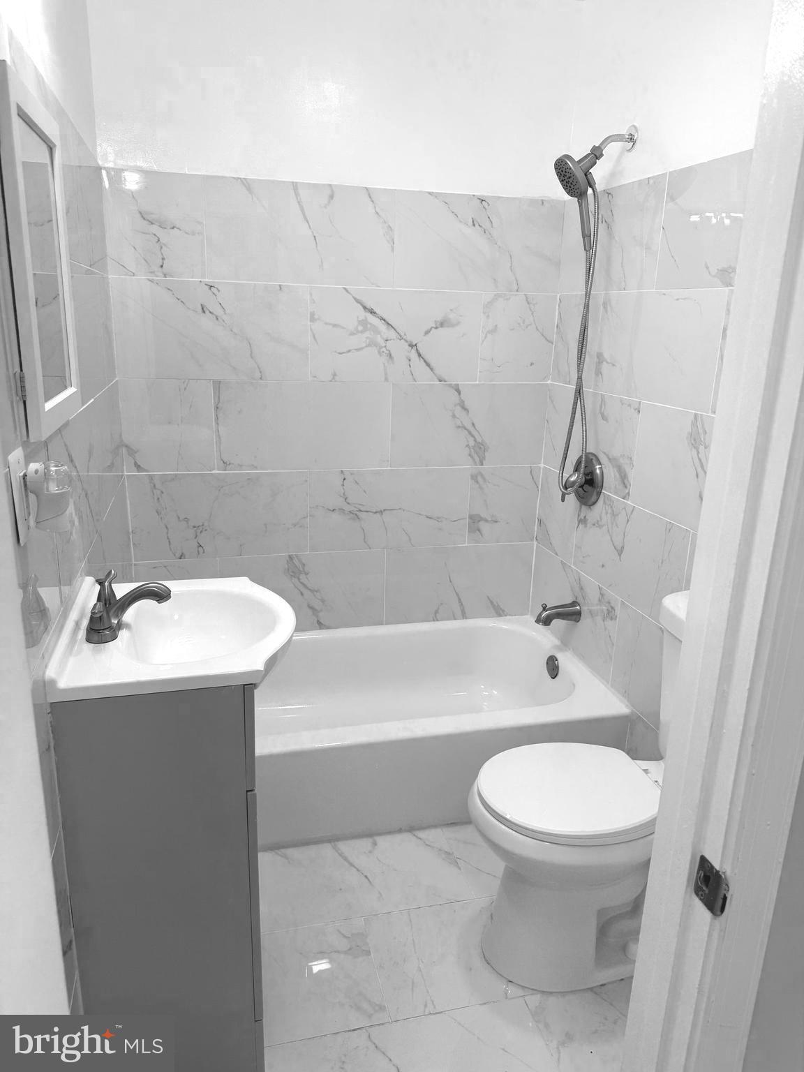 815 East Cold Spring Lane Baltimore, MD 21212 - Photo 35 of 43 a bathroom with a sink toilet and shower