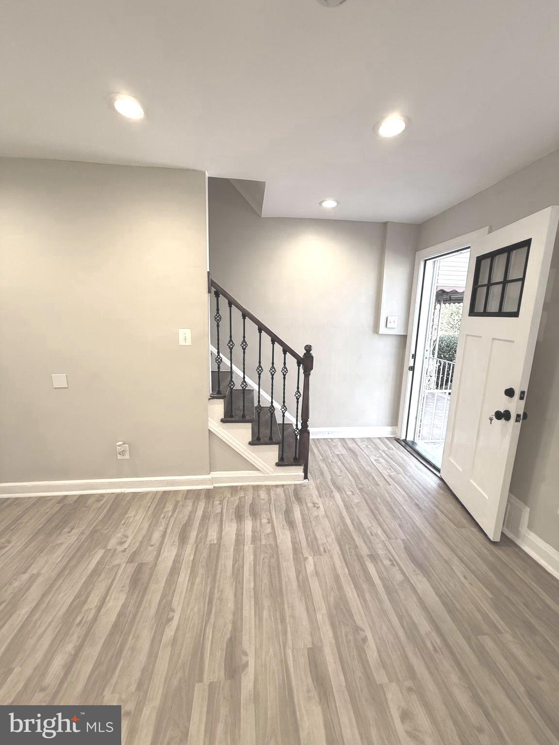 815 East Cold Spring Lane Baltimore, MD 21212 - Photo 8 of 43 wooden floor in an empty room with a window