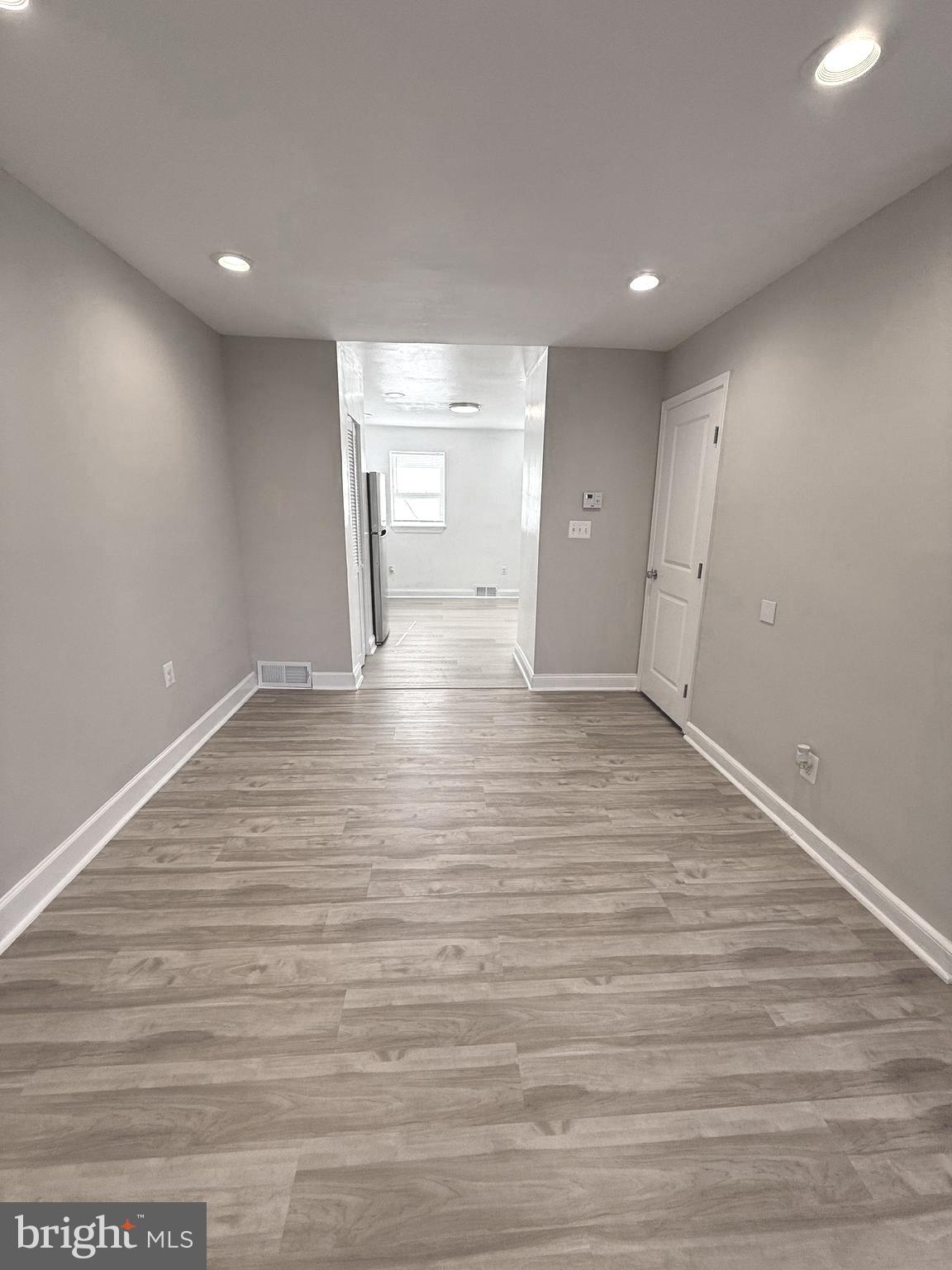 815 East Cold Spring Lane Baltimore, MD 21212 - Photo 9 of 43 a view of an empty room with wooden floor and closet