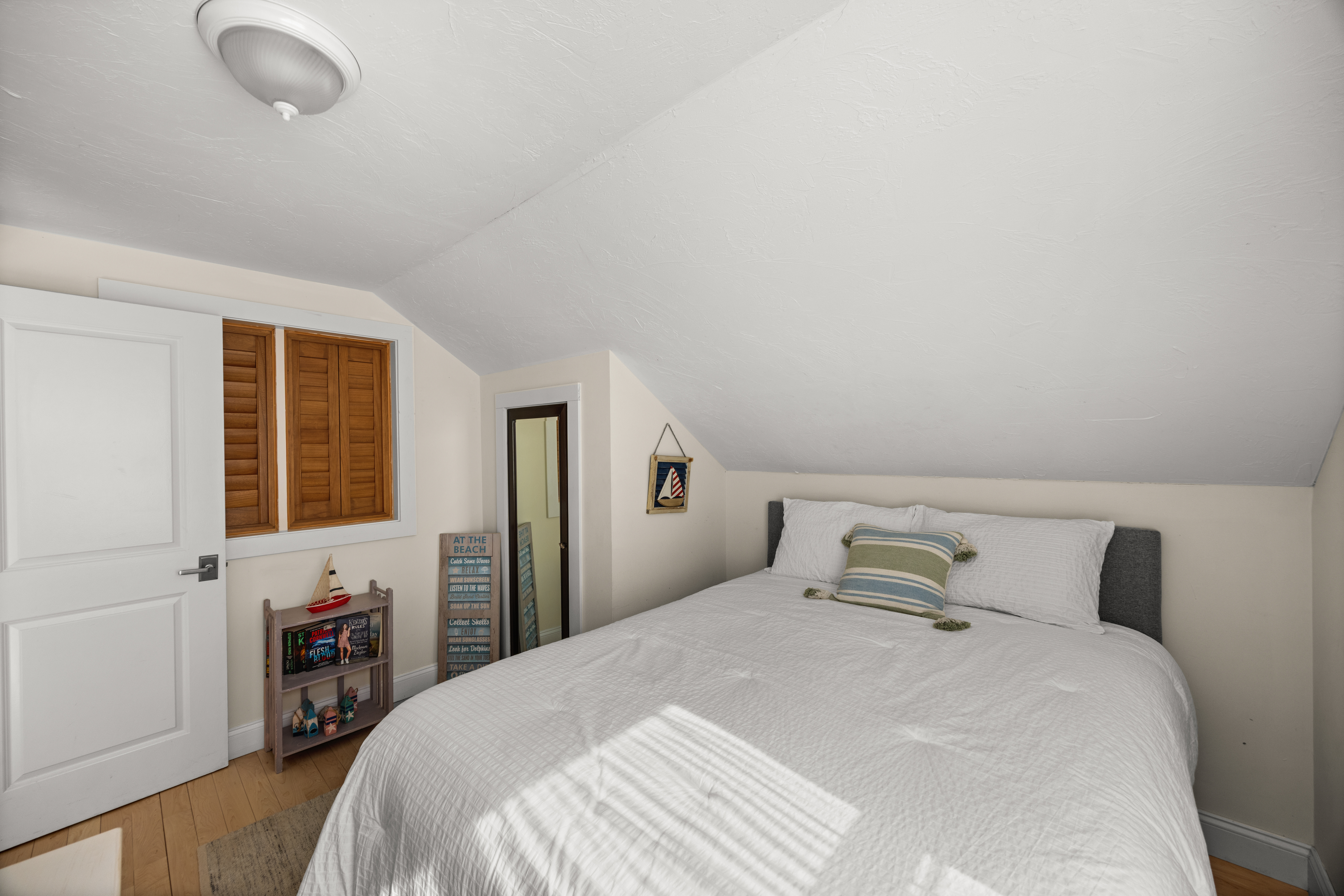58 Rd To The Plaines Edgartown, MA 02539 - Photo 35 of 40 a bedroom with a bed and a large window