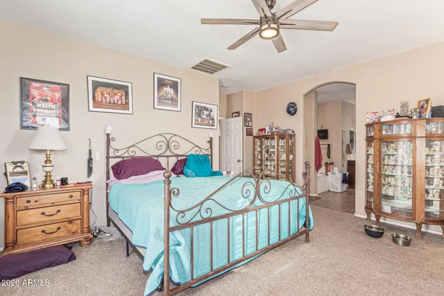 a bathroom with a sink vanity mirror and toilet