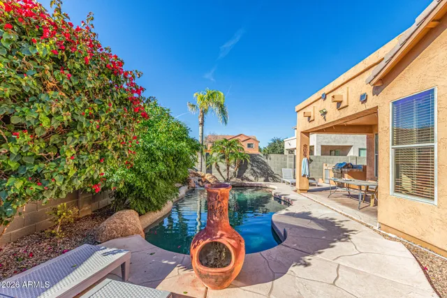 a backyard of a house with outdoor seating