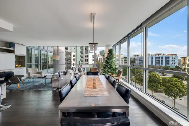 a view of living room with floor to ceiling window and floor