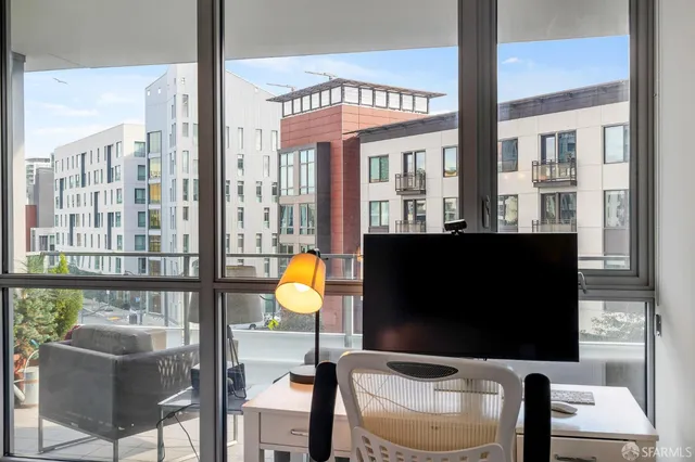 a living room filled with furniture and a flat screen tv