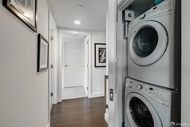 a view of a hallway with washer and dryer