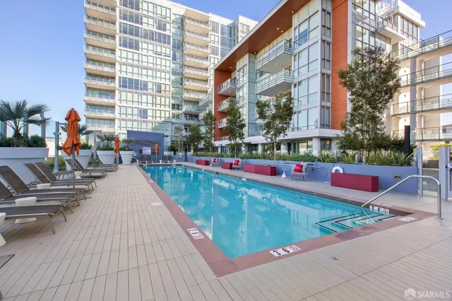 a view of a swimming pool with sitting area