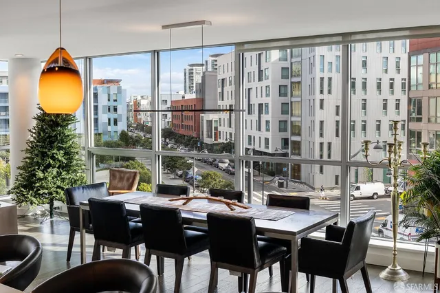 a view of a dining room with furniture and chandelier