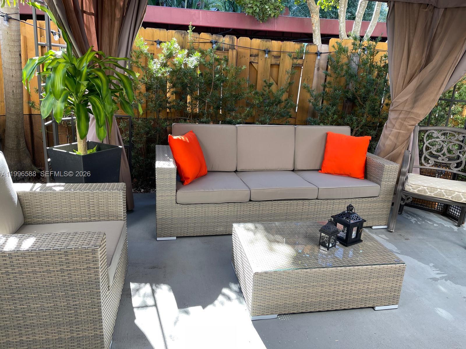 8441 Southwest 124th Avenue, Unit 106 Miami, FL 33183 - Photo 19 of 24 a view of a couches in a patio