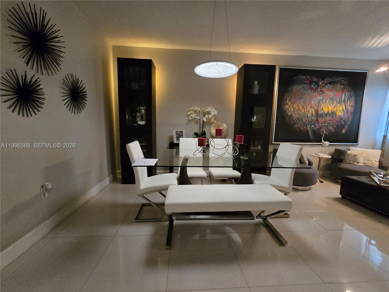 8441 Southwest 124th Avenue, Unit 106 Miami, FL 33183 - Photo 5 of 24 a living room with furniture and a flat screen tv