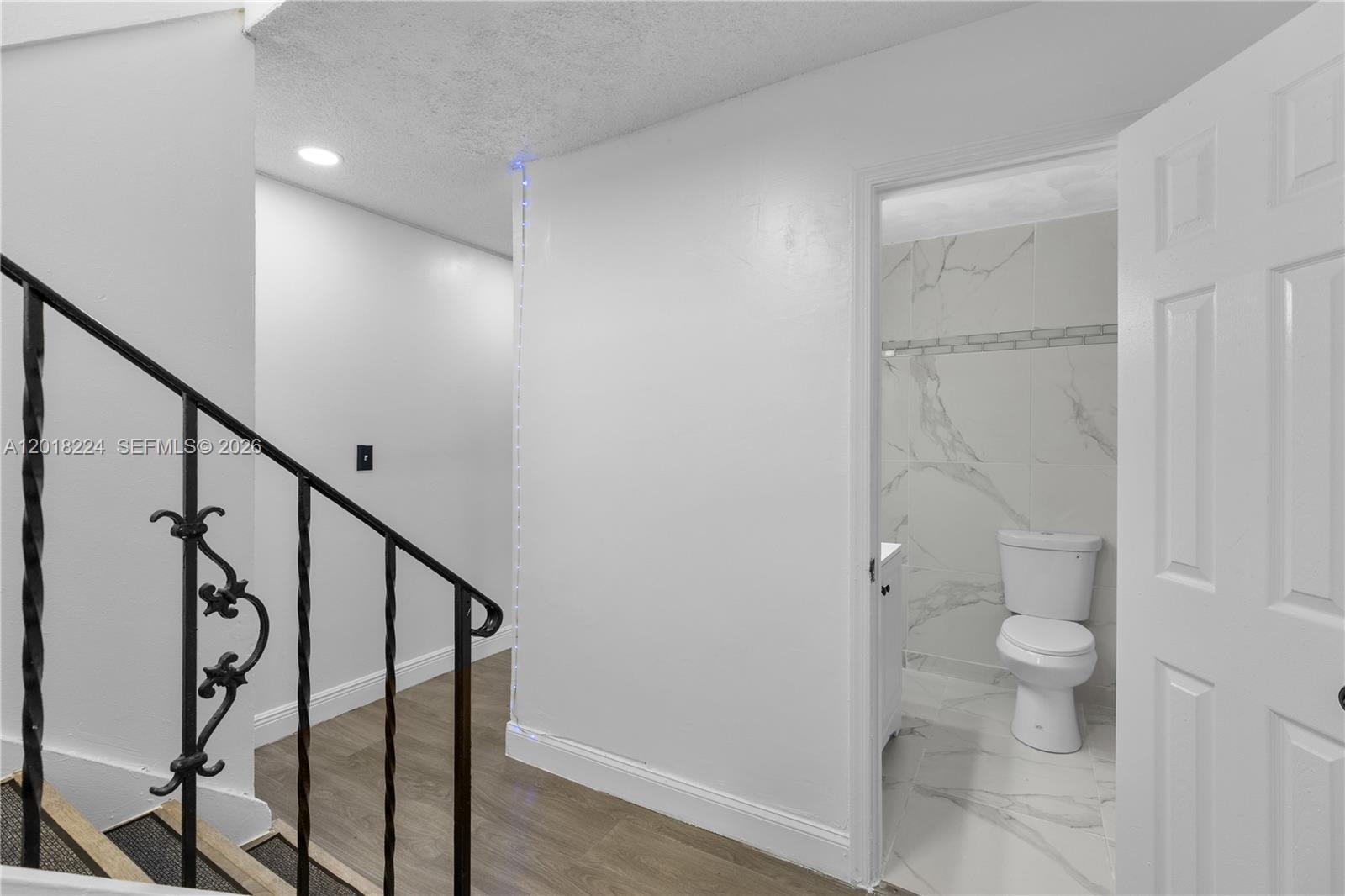7958 Southwest 6th Street Pompano Beach, FL 33068 - Photo 12 of 57 a bathroom with a shower and toilet
