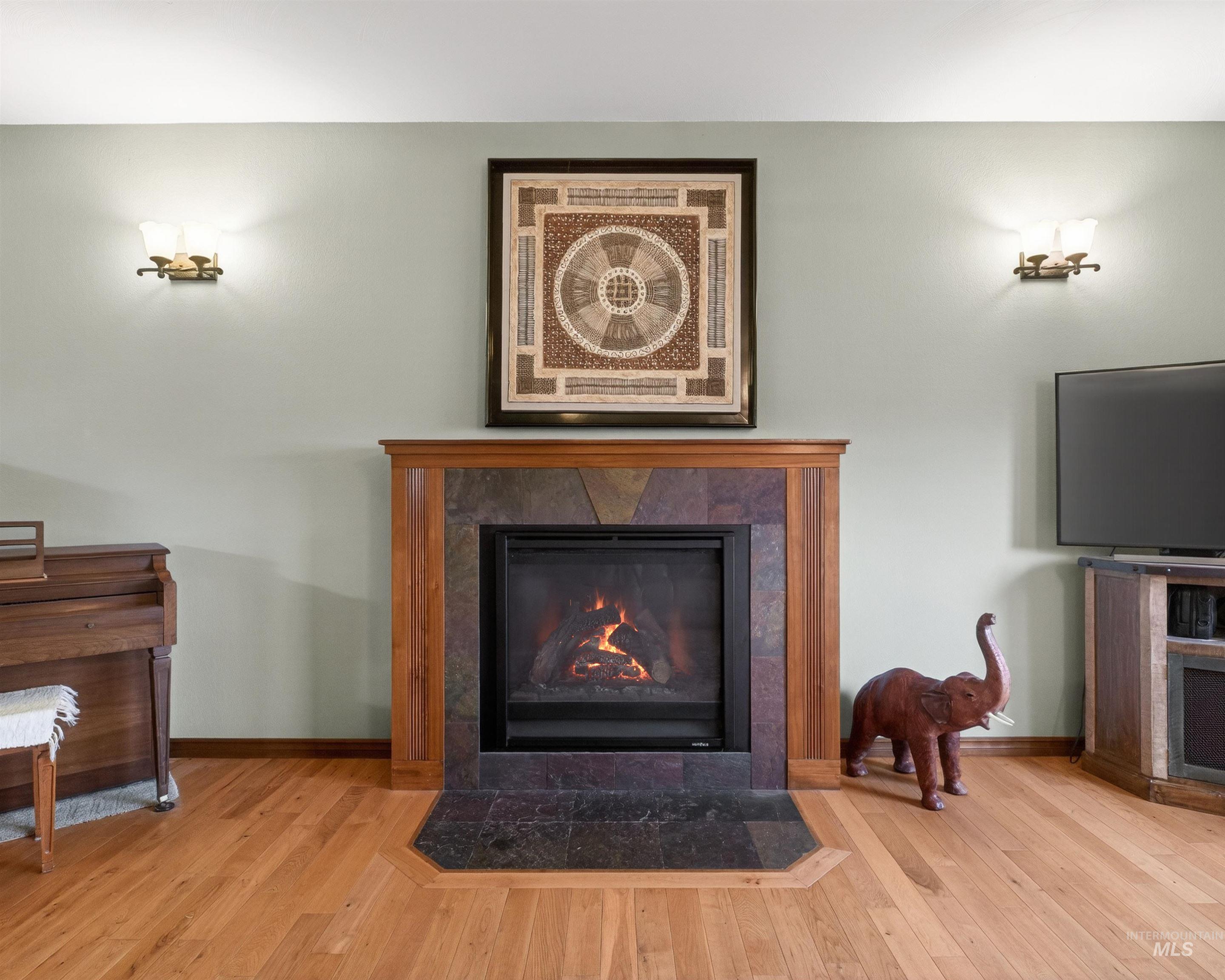 1933 Fletcher Place Moscow, ID 83843 - Photo 6 of 44 Detailed view of a fireplace and wood finished floors