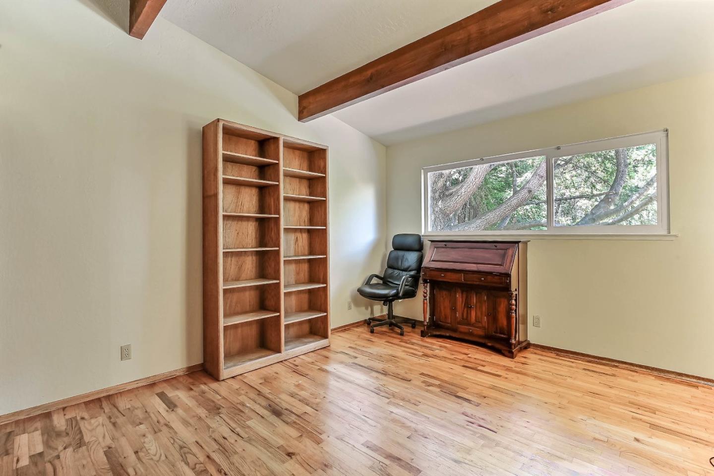 655 Aurora Road Soquel, CA 95073 - Photo 11 of 22 a view of an empty room with a window and wooden floor
